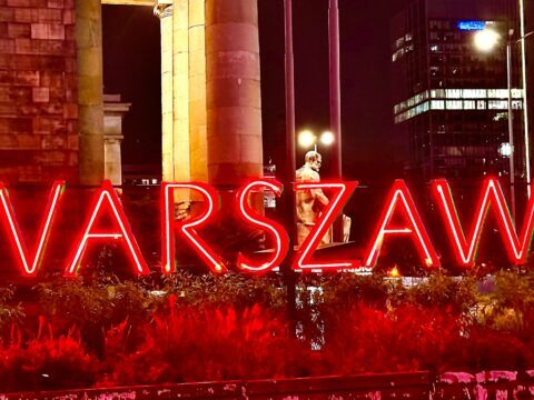 A picture of the neon Warszawa sign at The Palace of Science and Culture in Warsaw, Poland