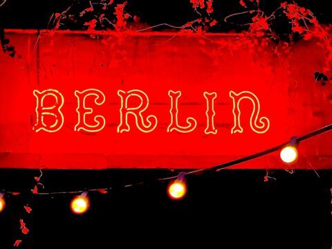 A picture of the neon Berlin sign on a building in Warsaw, Poland